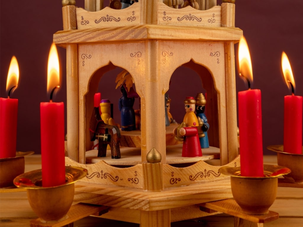 Decorative Christmas pyramid with candles and figures