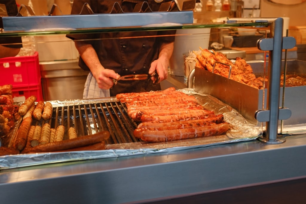 Traditional German sausages grilling at Cologne street market