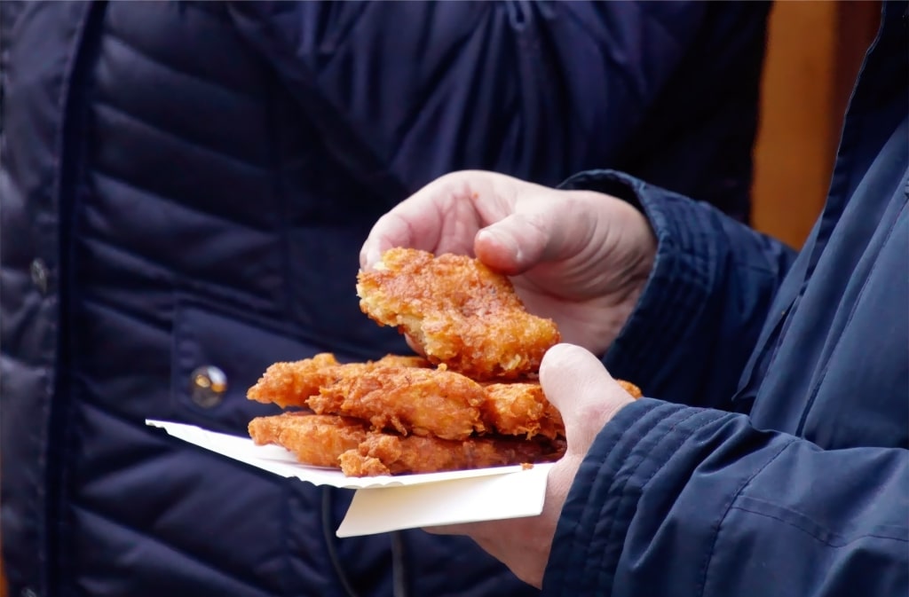 Freshly fried Reibekuchen potato pancakes at German Christmas market