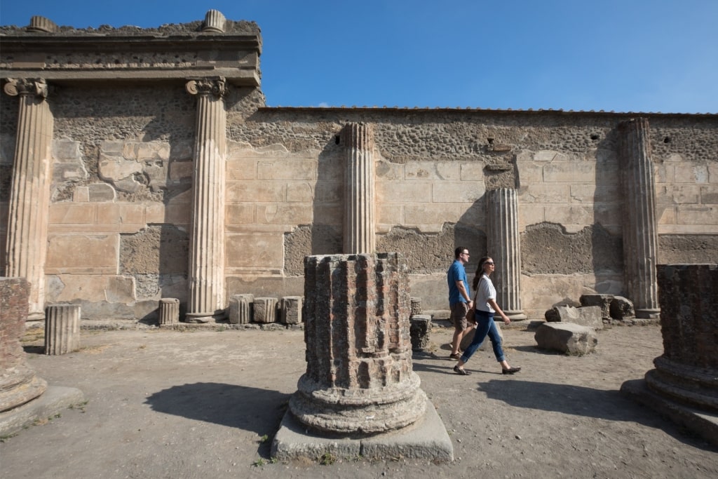 Couple exploring the historic site of Pompeii, Italy