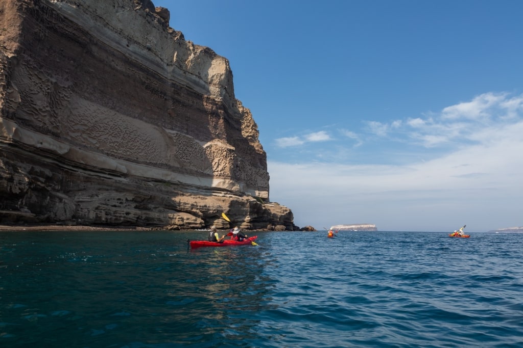 People kayaking in Santorini, Greece