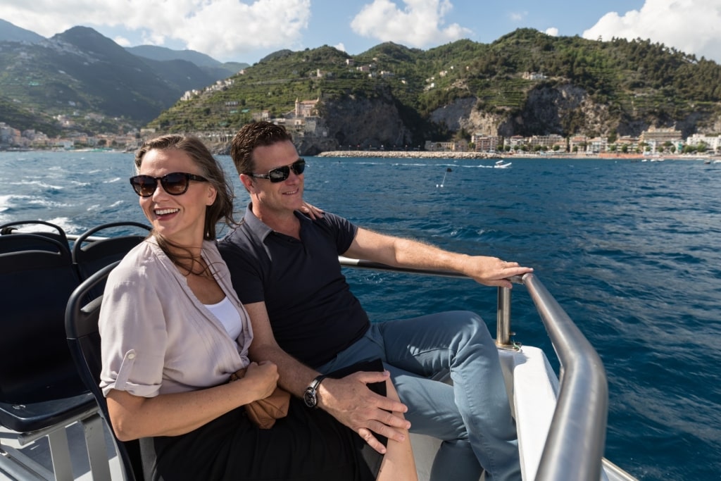 Couple on a boat tour along Amalfi Coast, Italy