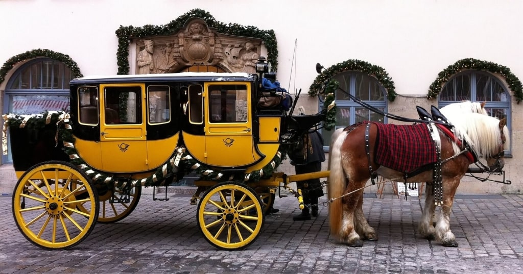 Decorated holiday stagecoach with horses at Nuremberg Christmas market