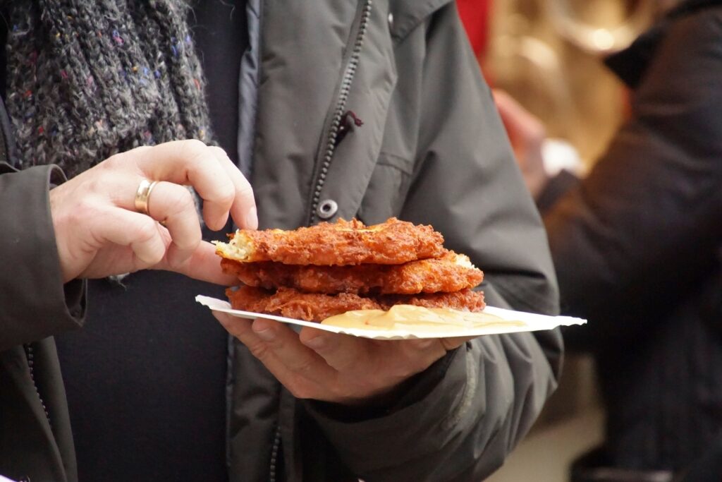 Golden crispy Kartoffelpuffer potato pancakes at Christmas market