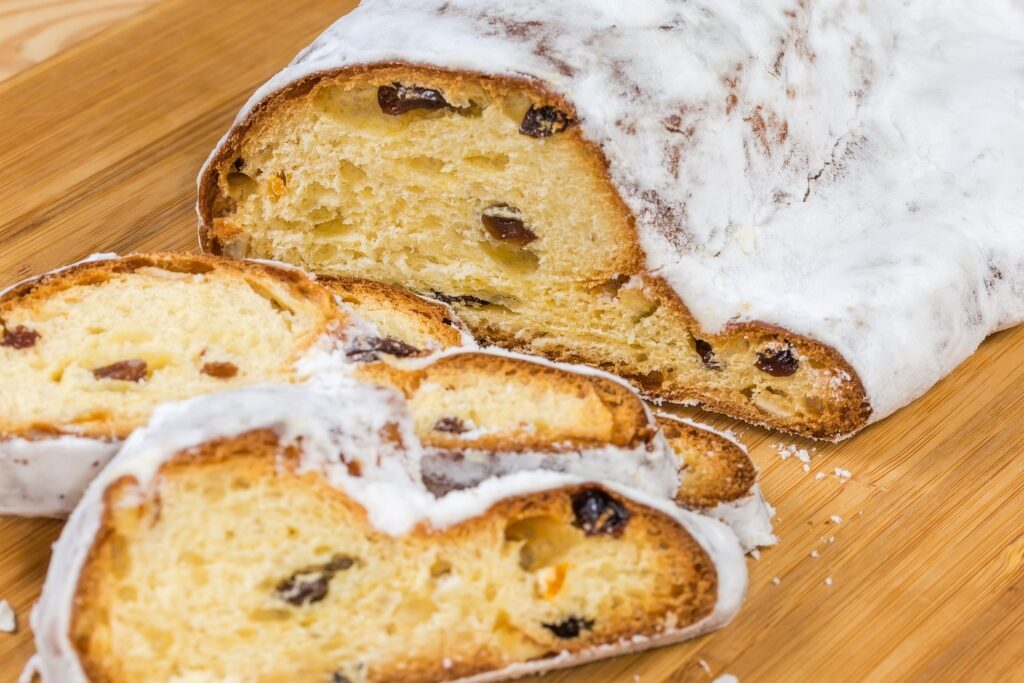 Close-up of festive Stollen slice with dried fruits and nuts