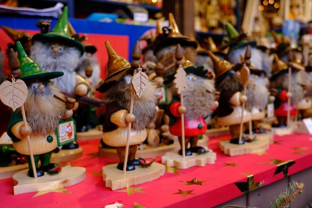 Colorful holiday ornaments and souvenirs at a Christmas market stall
