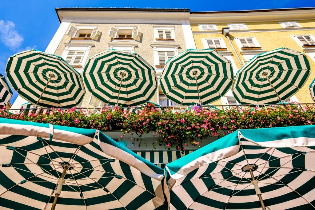 Outdoor umbrellas at historic Café Tomaselli in Salzburg