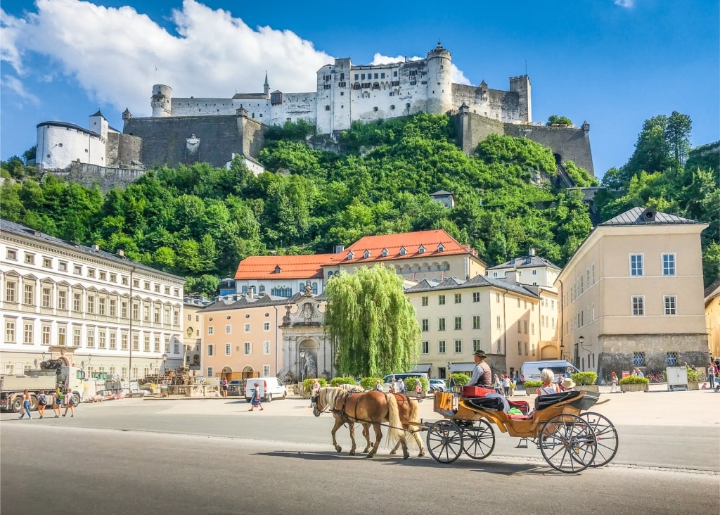Scenic view of Hohensalzburg Fortress with horse-drawn carriage in Salzburg