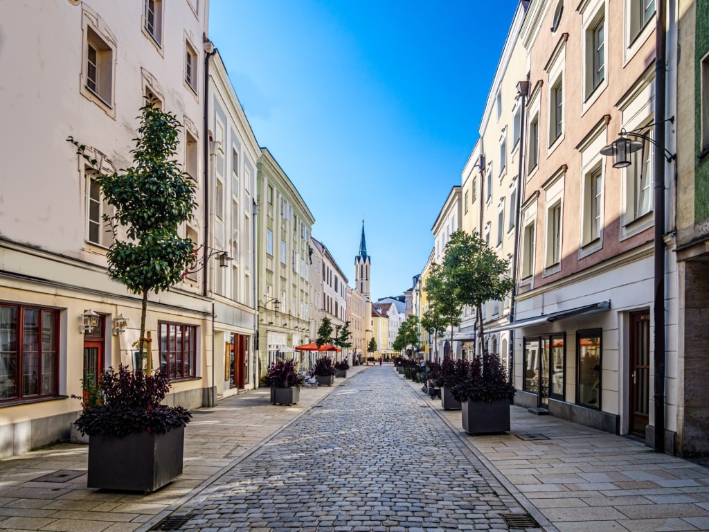 Historic Passau Old Town street lined with colorful storefronts
