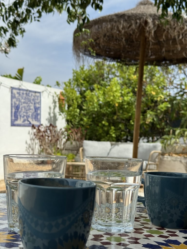 Close-up of blue cups and water glasses on table in Portugal