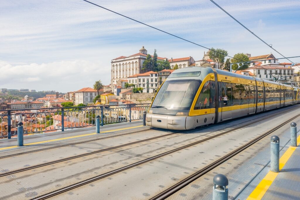 Modern tram on railway tracks in Porto, Portugal