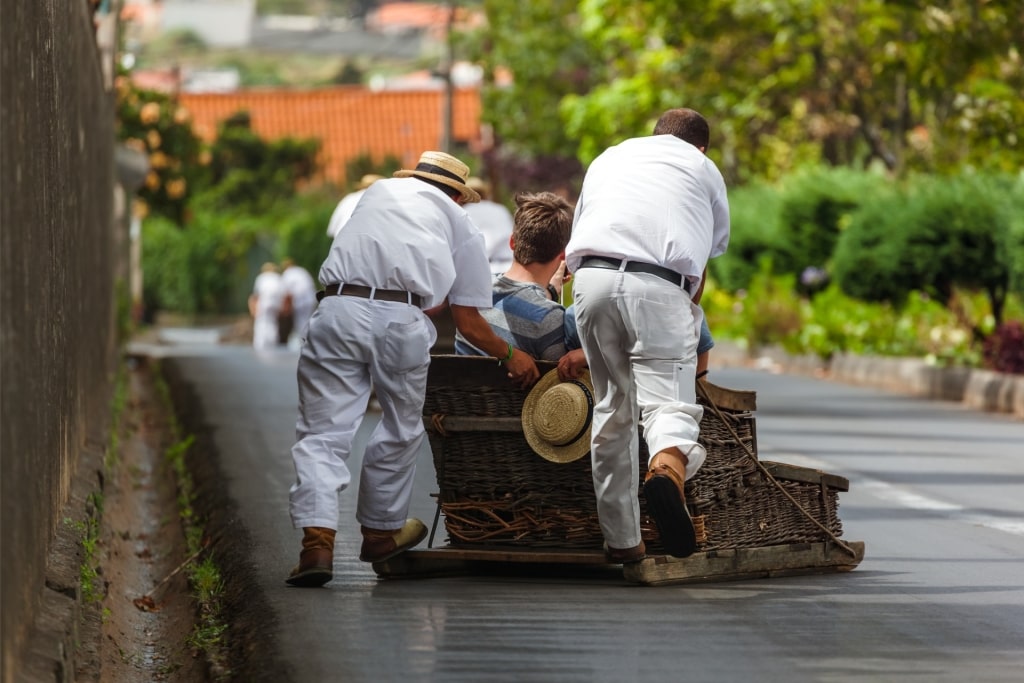 Toboggan riders on sledge in Monte - Funchal, Madeira