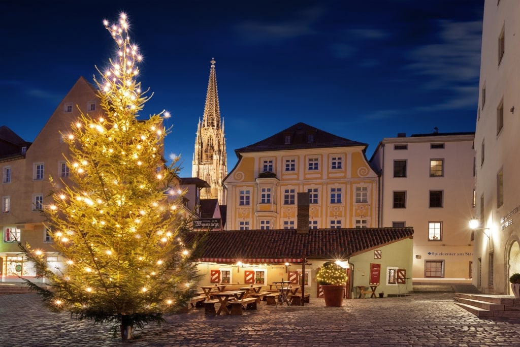 Christmas tree decorated with lights at traditional sausage stall in Regensburg