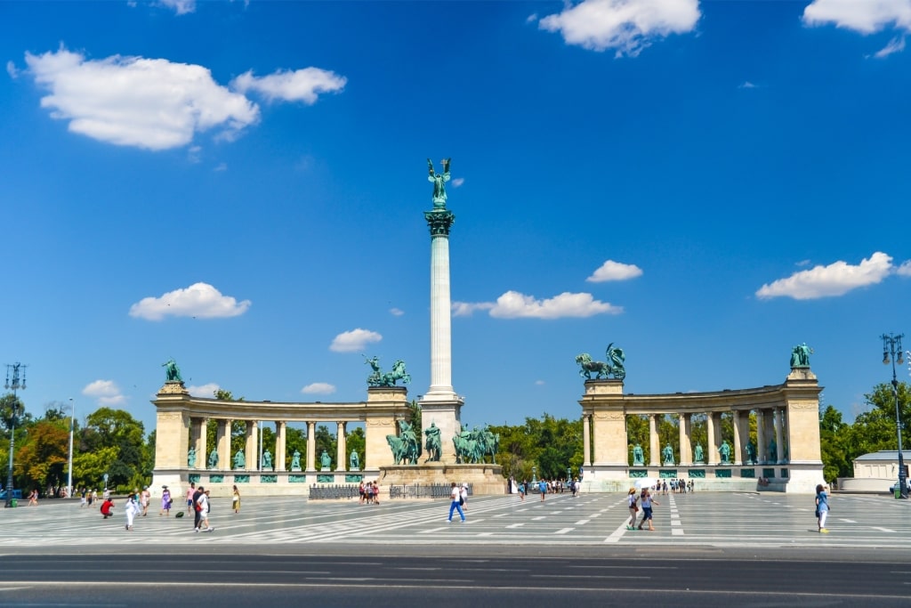 Tourists visiting Heroes' Square in Budapest with Millennium Monument