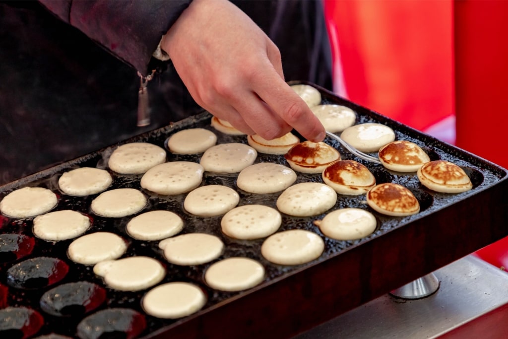 Traditional Dutch poffertjes as street food in Amsterdam