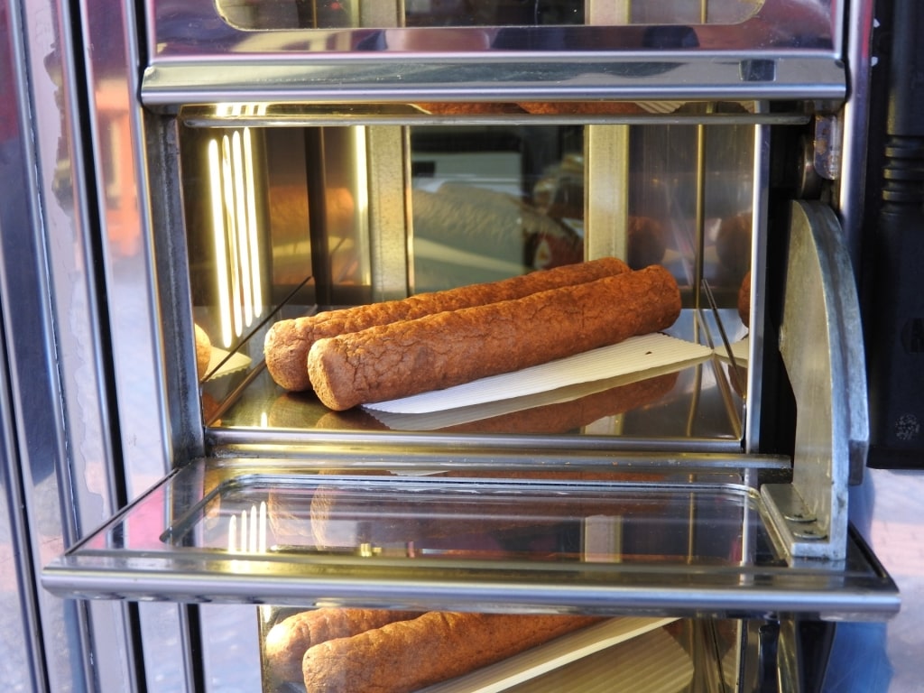 Popular Dutch snack frikandel in vending machine at Amsterdam food market