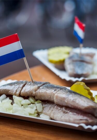 Street food in Amsterdam Haring fillet served on paper cup