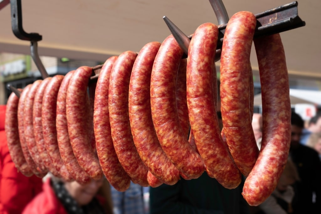Traditional Dutch rookworst sausages hanging in market