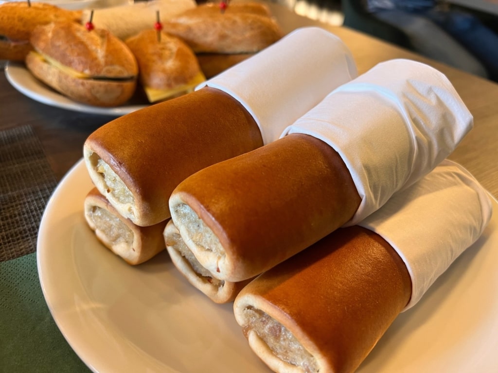 Traditional Dutch worstenbroodje sausage roll on a plate