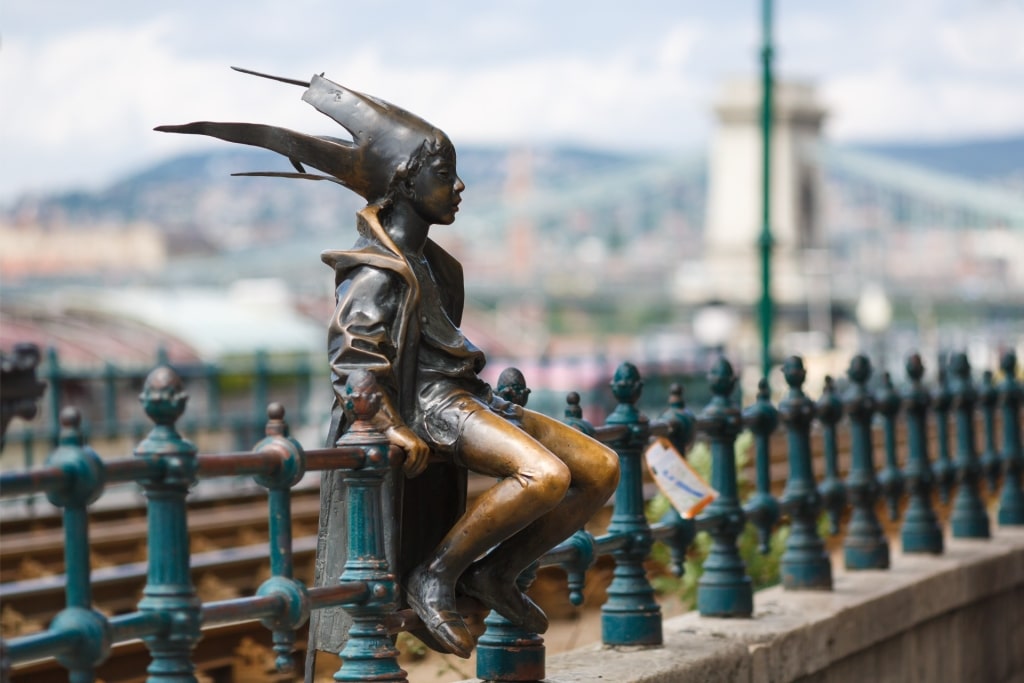 The Little Princess Statue sitting on the Danube promenade in Budapest