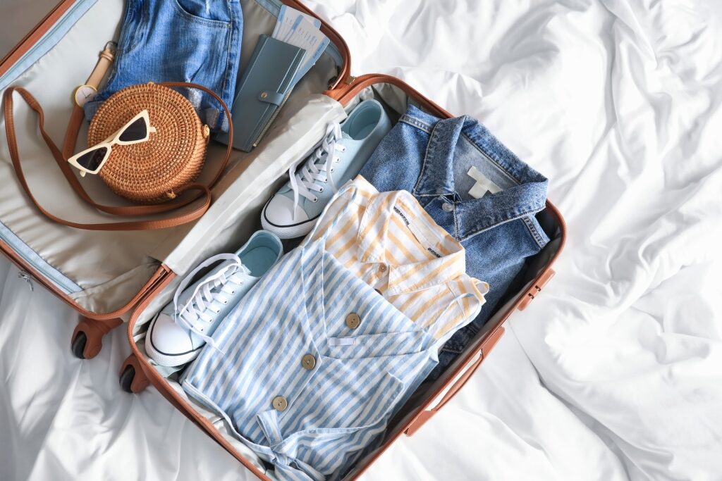 Luggage with sneakers and clothing