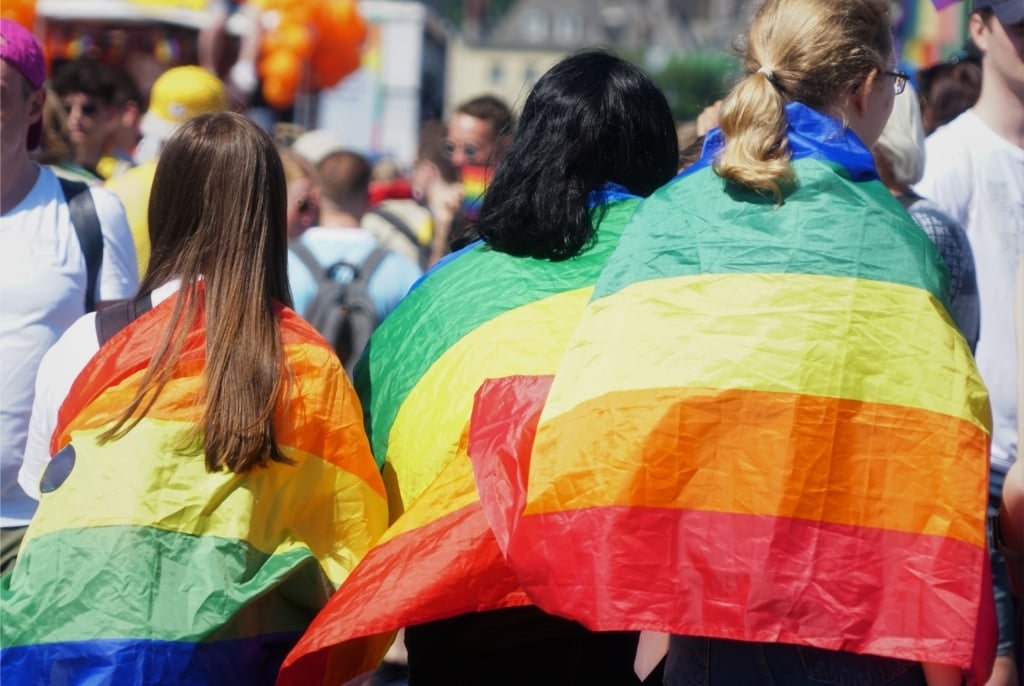 People wearing rainbows during Christopher Street Day