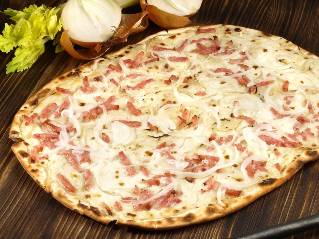Thin crust Alsace-style pizza known as Tarte Flambée