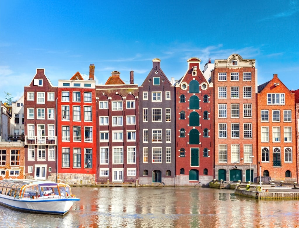 Picturesque row of traditional canal houses in Amsterdam