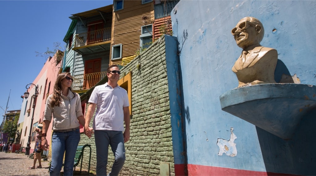 Couple exploring Caminito street in Buenos Aires, Argentina