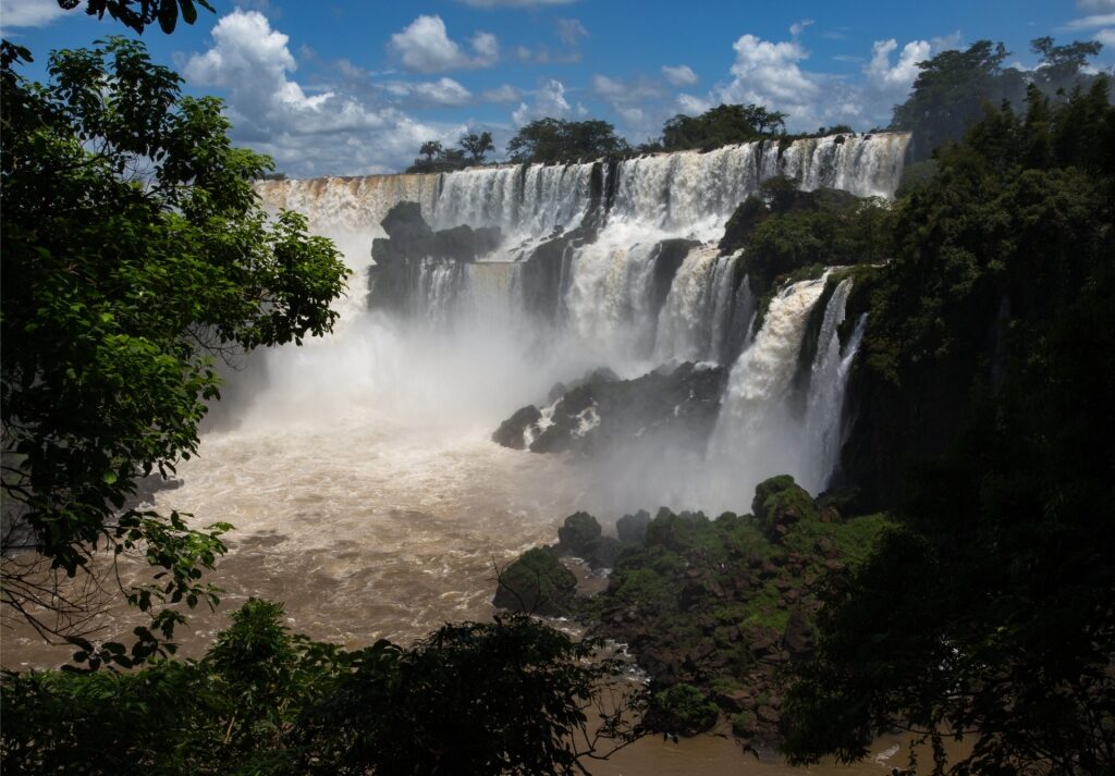 Panoramic view of Iguazu Falls cascading between Argentina and Brazil