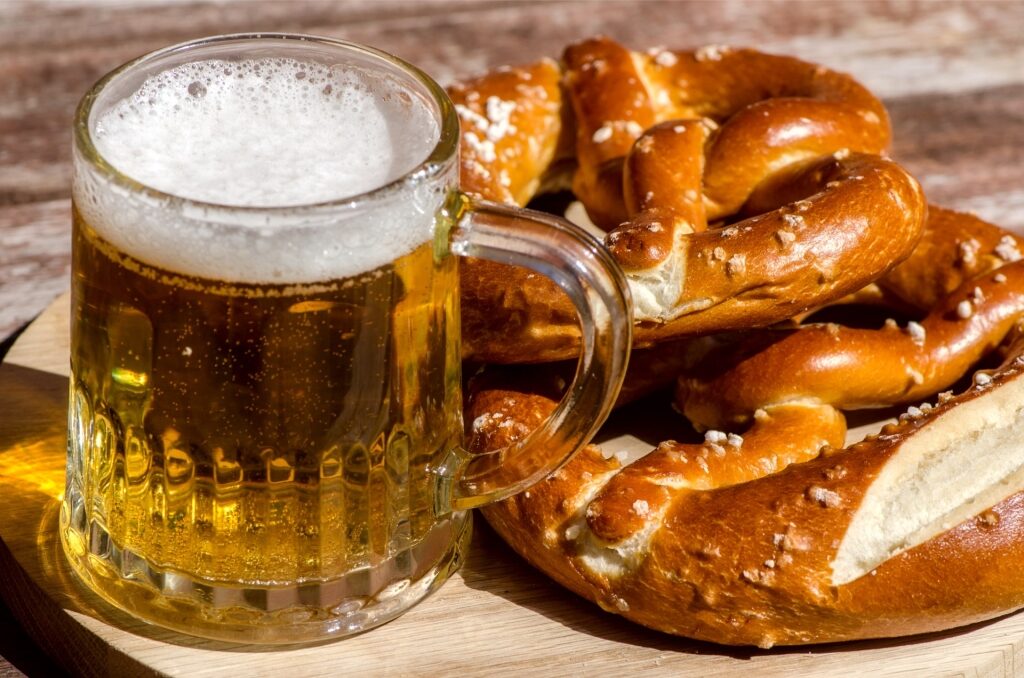 Classic Oktoberfest beer mug with freshly baked German pretzels