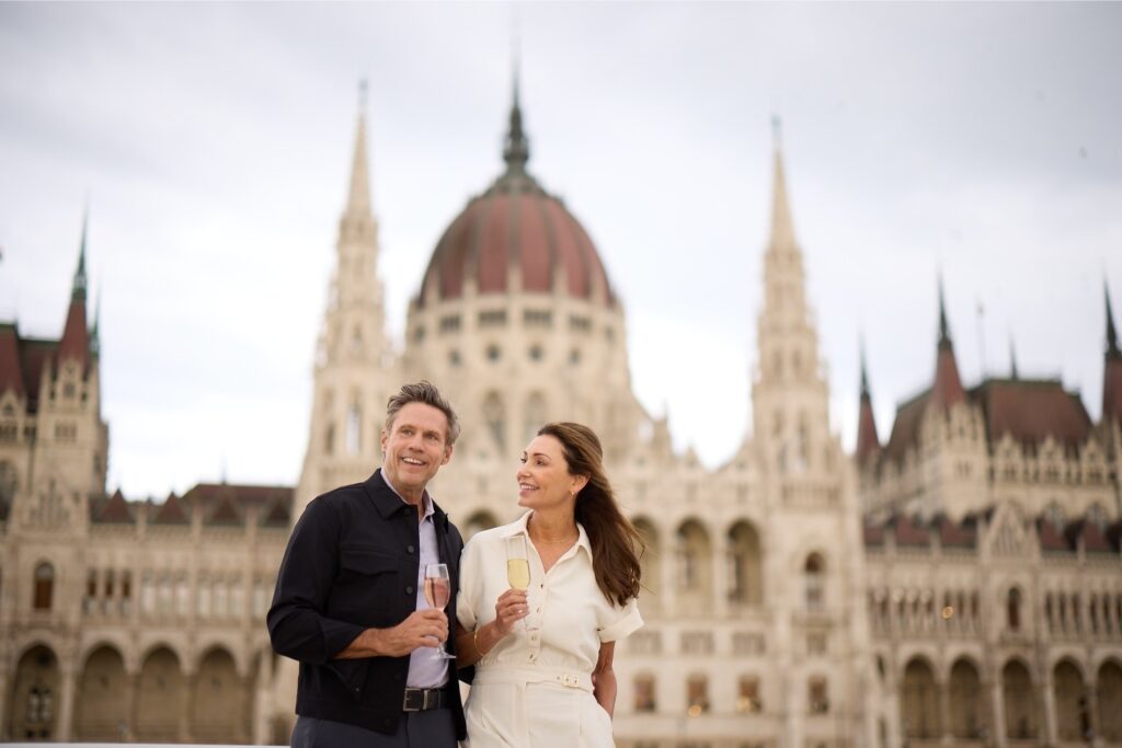 Couple with the Hungarian Parliament Building in Budapest as a backdrop