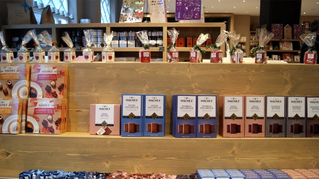 Assorted Hachez chocolates displayed on a store shelf in Hamburg