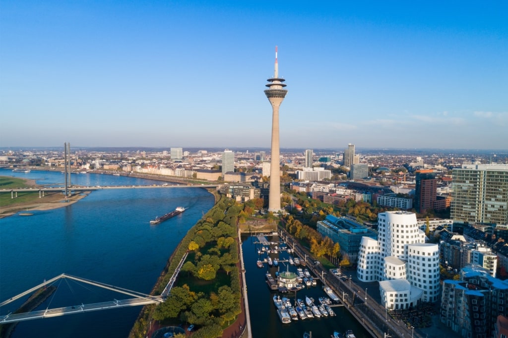 Aerial view of Düsseldorf’s harbor district featuring the iconic Rhine Tower and surrounding buildings