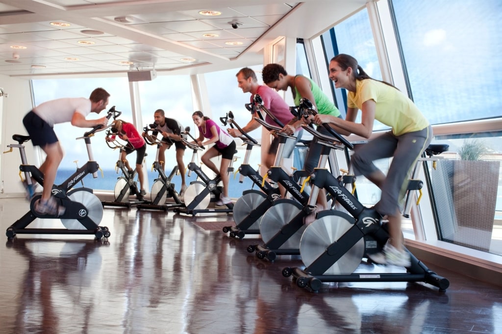 Cruise Ship Amenities - Guests working out at the fitness center aboard Celebrity Cruises
