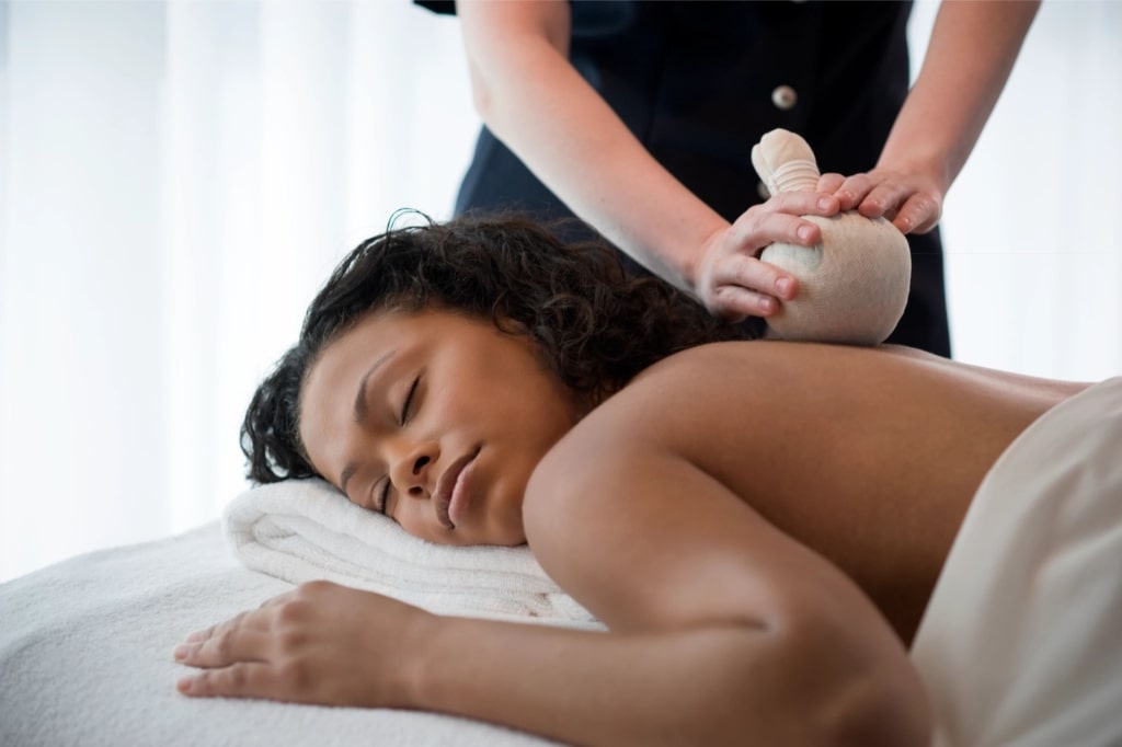 Guest receiving a relaxing spa treatment aboard Celebrity Cruises