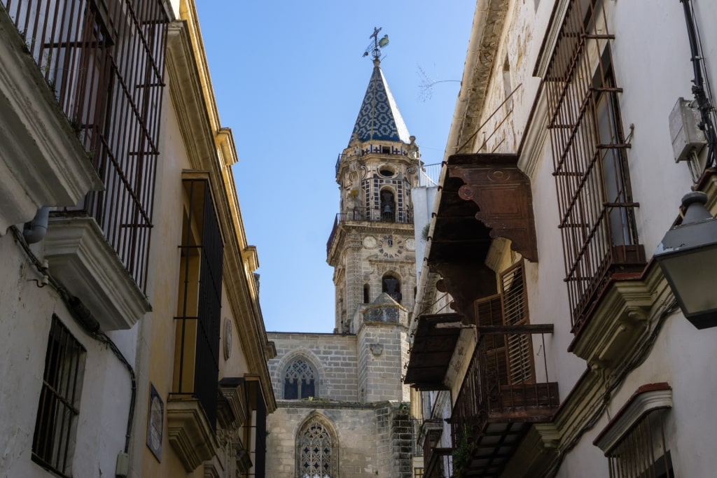 Historic San Miguel Church seen from narrow street in Jerez de la Frontera