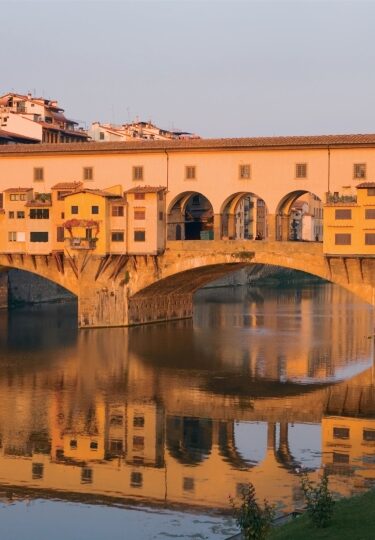 Historic Ponte Vecchio bridge over the Arno River in Florence, Italy