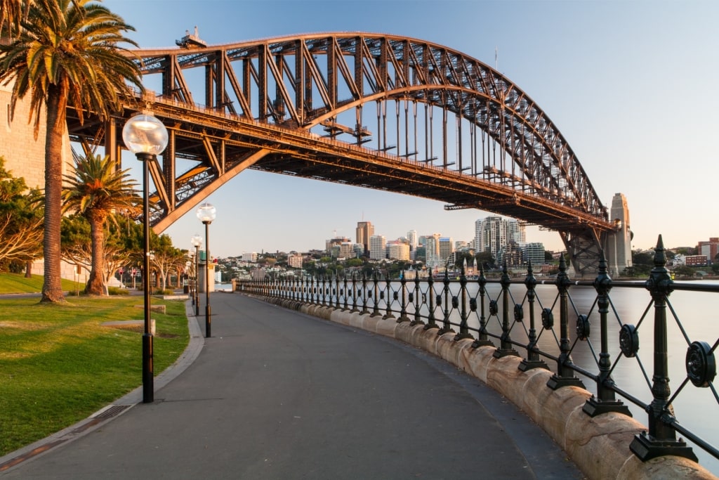 Scenic promenade along Sydney Harbour with the iconic Sydney Harbour Bridge in the background