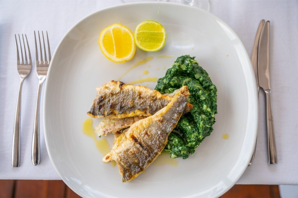 Fish dish served with lemon and herbs in Montenegro