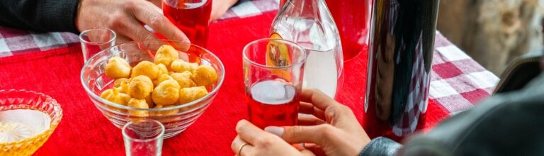 Traditional Montenegrin priganice fried dough balls with drinks