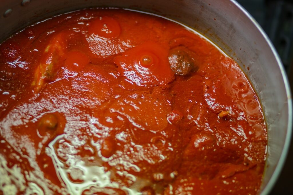 Close-up while cooking Ragù Napoletano