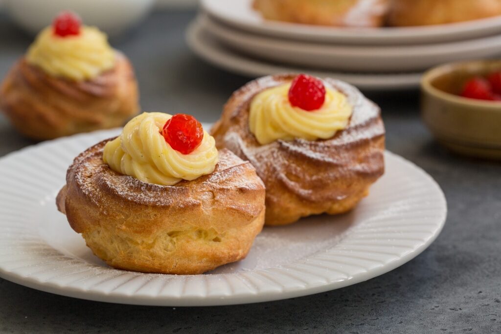 Plate of decadent Zeppole di San Giuseppe