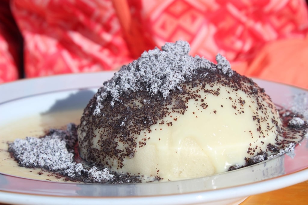 Sweet steamed Germknödel pastry with Powidl filling and poppy seed topping