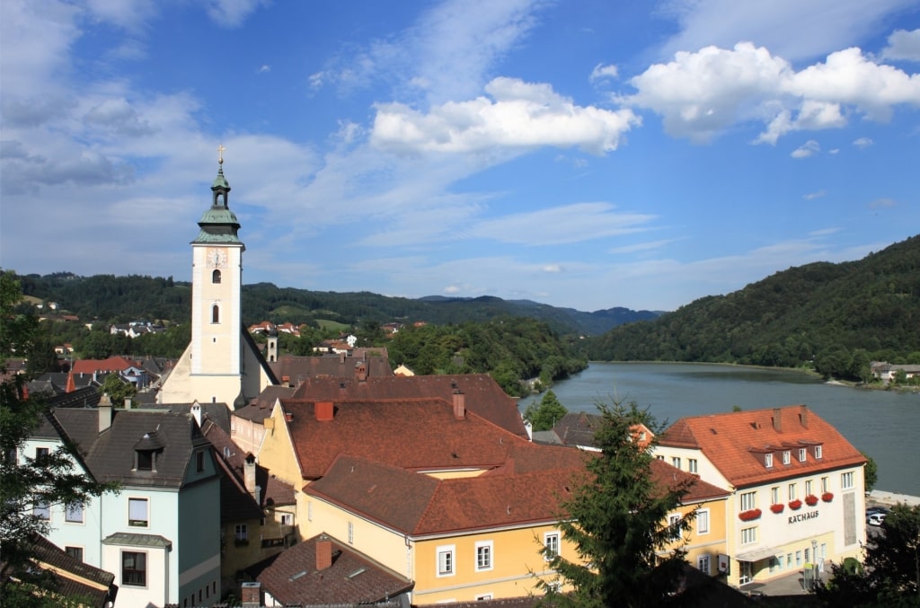 Scenic view of Grein, Austria, with the church tower along the Danube River