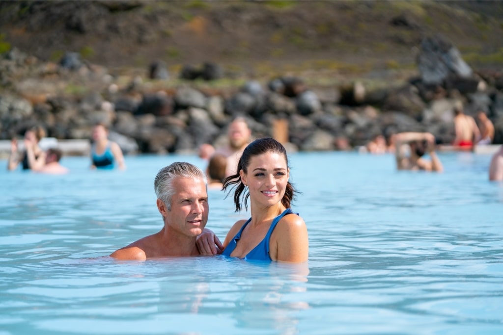Tourists relaxing in Mývatn Nature Baths, one of the most popular geothermal lagoons in Iceland