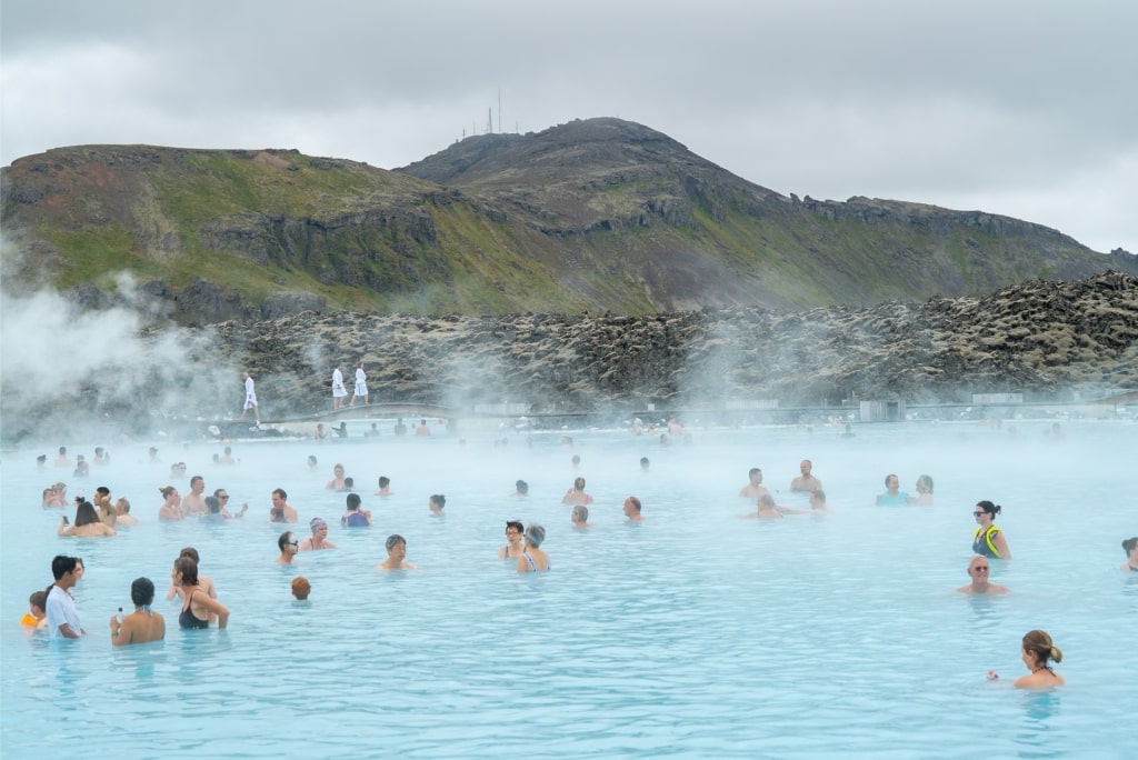 Tourists relaxing in Blue Lagoon, one of the most popular geothermal lagoons in Iceland