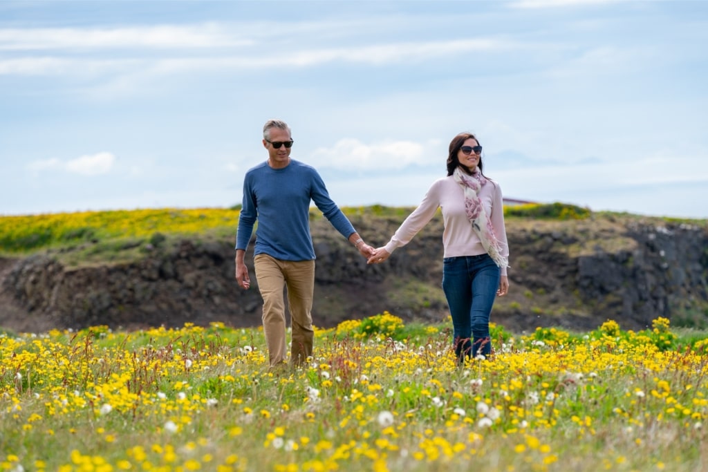 Couple exploring Grímsey Island in Iceland