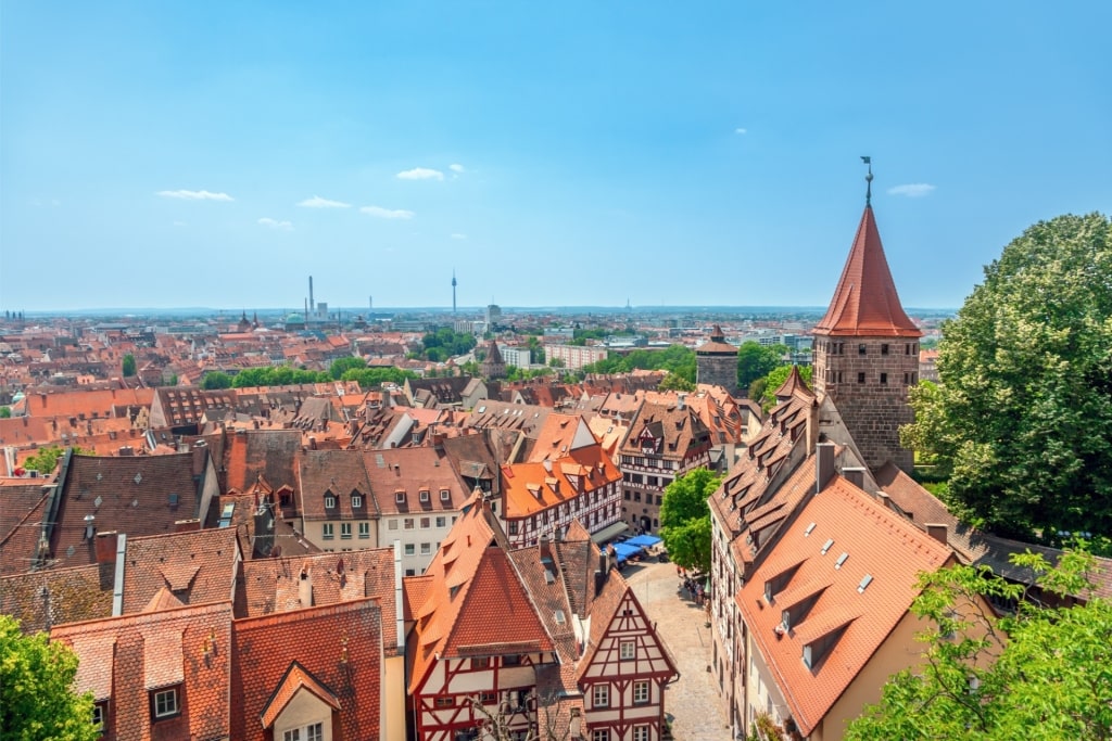 Aerial view of Old Town Nuremberg with red-roofed buildings and church tower