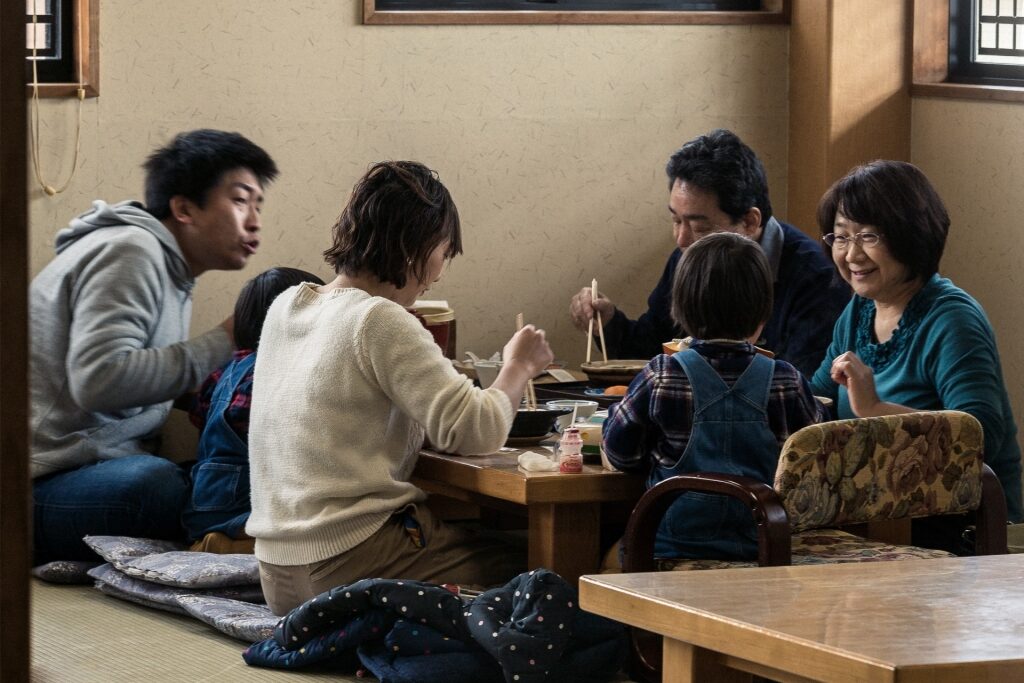 Family enjoying a meal together at a Japanese restaurant
